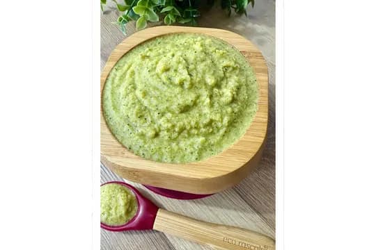 Serving homemade chicken, broccoli, and sweet potato purée in a baby bowl – nutritious first food