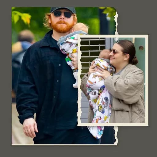 Image of a couple together holding a baby.