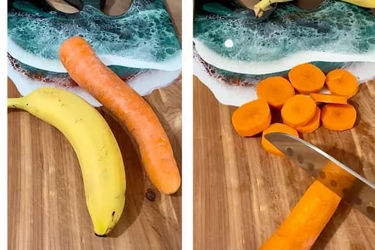 "Whole banana and raw carrot on a wooden cutting board, with the second frame showing the carrot being sliced, illustrating ingredients for baby food or healthy snacks."