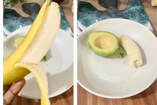 "Peeled banana and halved avocado placed in a bowl on a kitchen counter for a healthy recipe preparation"
