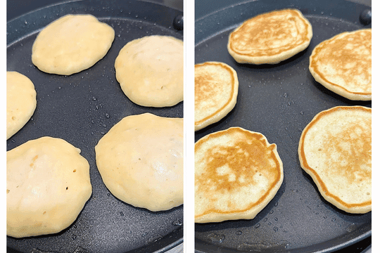 Small dollops of pancake batter cooking on the pan, with bubbles forming on the surface and edges setting before flipping. Some pancakes are already golden on one side.