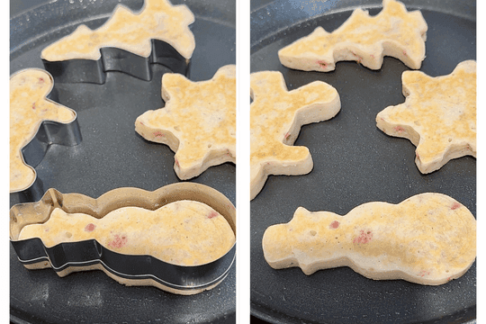 Removing cookie cutter and flipping shaped pancake to cook the other side until golden brown for a festive Christmas breakfast.