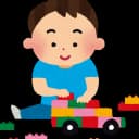 Watercolor-style illustration of a happy toddler or young boy with brown hair, wearing a blue shirt and jeans, sitting on the floor and playing with colorful building blocks.