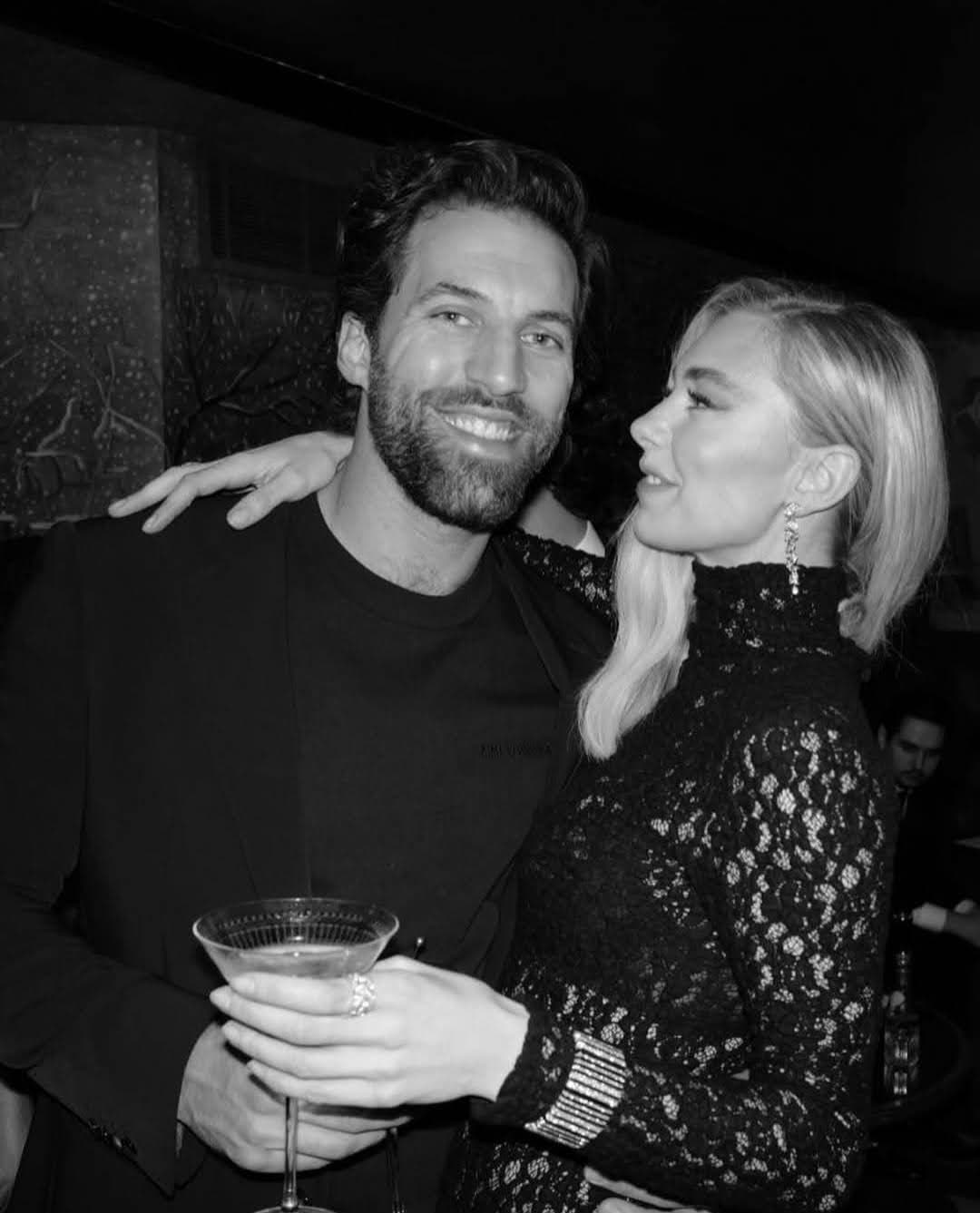 Vanessa Kirby and her partner or date at a black tie event, holding a cocktail.