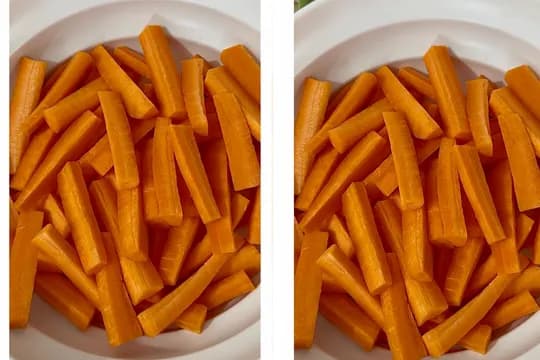 "Freshly cut carrot sticks in a white bowl, ready for snacking, cooking, or healthy meal preparation."