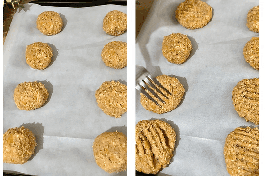 Spoonfuls of cookie dough being shaped and flattened onto a parchment-lined baking tray, ready for the oven.