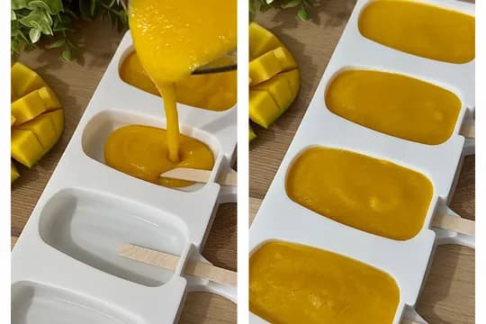 Homemade mango pospicle pour into poscicle mold.
