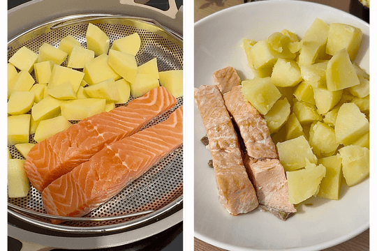 Potato chunks and salmon fillet steaming in a basket over boiling water until tender and fully cooked.