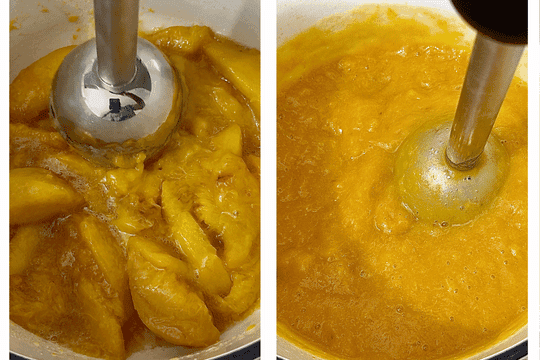 A hand blender blending softened peaches into a smooth puree directly in the saucepan, with steam rising as the mixture cools slightly.