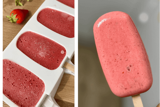 "Running popsicle mold under warm water to release frozen strawberry yogurt pops."