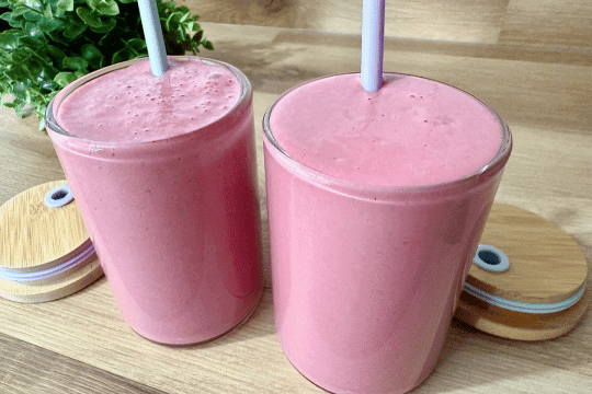 "Freshly blended beetroot and berry smoothie poured into clear glasses, ready to serve or chill for a refreshing treat."