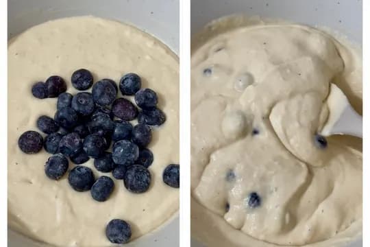 Gently folding fresh blueberries into pancake batter—ensuring even distribution for delicious blueberry sheet-pan pancakes.