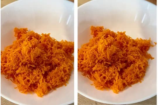 Grated fresh carrots in a mixing bowl – prep step for healthy applesauce carrot breakfast cake