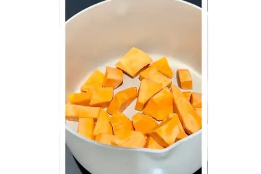 Chopped sweet potatoes into small cubes for even cooking in baby porridge or puree.