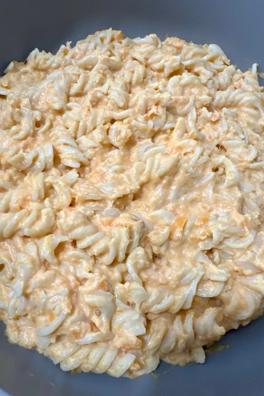 Creamy sweet potato pasta served in a bamboo bowl, a healthy and delicious meal for babies and toddlers.