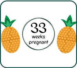 A pineapple with the text "33 weeks pregnant" displayed prominently on its surface, symbolizing pregnancy and growth.